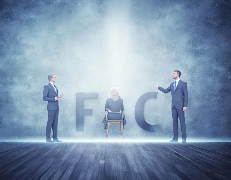 FAQ Two men stand beside a seated figure in a misty environment, with "FC" displayed behind.